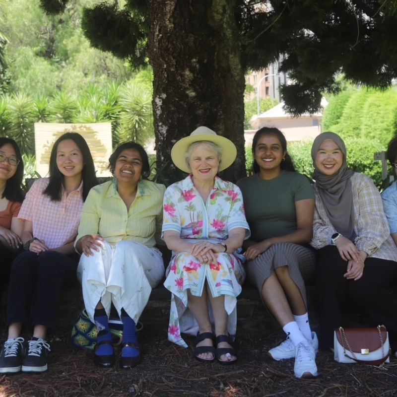 Her Excellency sitting with students at Lunch on the Lawns